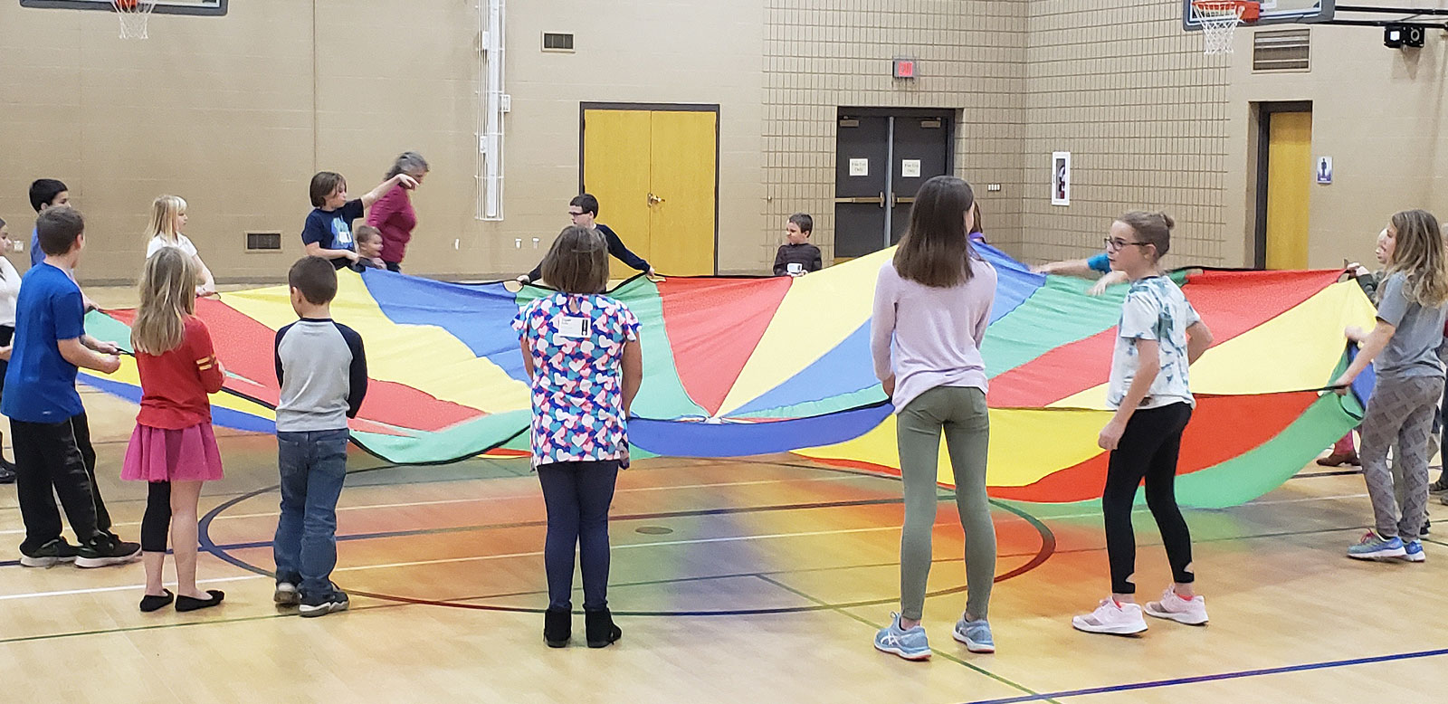 KidsWay playing with parachute